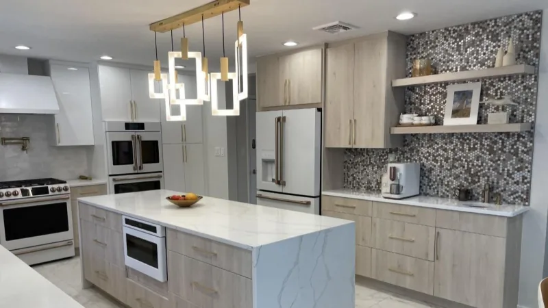 Detail of light wood cabinetry and mosaic backsplash