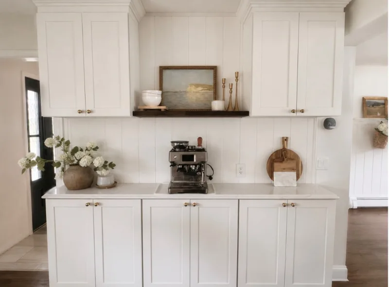 Built-in coffee nook with shaker cabinetry and floating shelf
