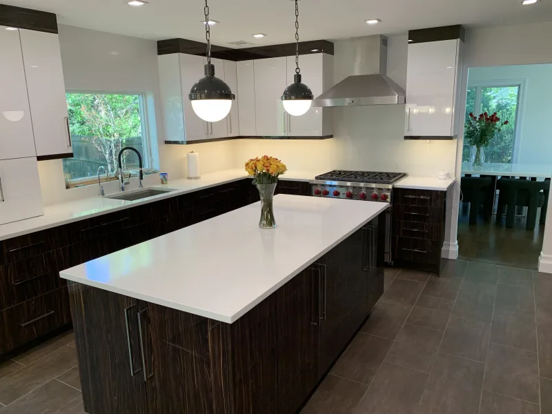 White and walnut kitchen with double island and pendant lighting